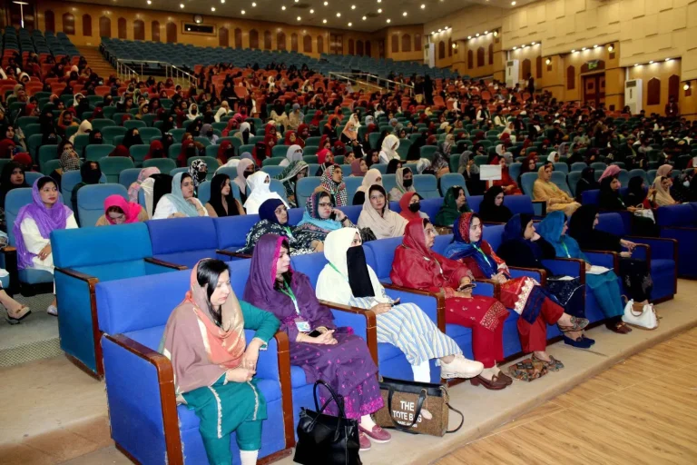 Delegates and faculty seated in the auditorium at GCHCSS-25, Bahauddin Zakariya University, Multan