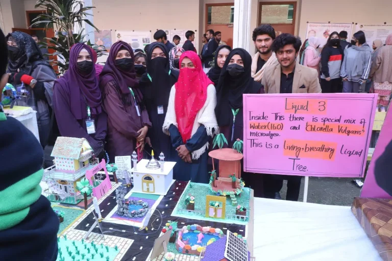 Students presenting their Liquid 3 microalgae model at the GSTMC-25 science exhibition in Jhang