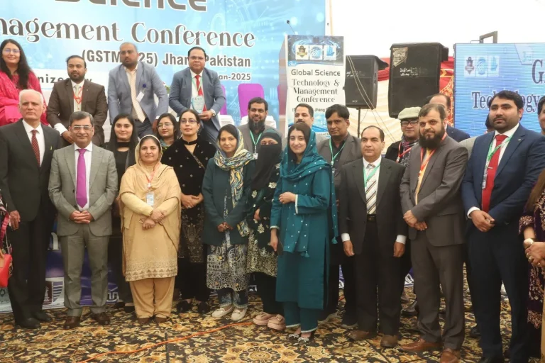Delegates and organisers group photo on stage under the GSTMC-25 banner in Jhang