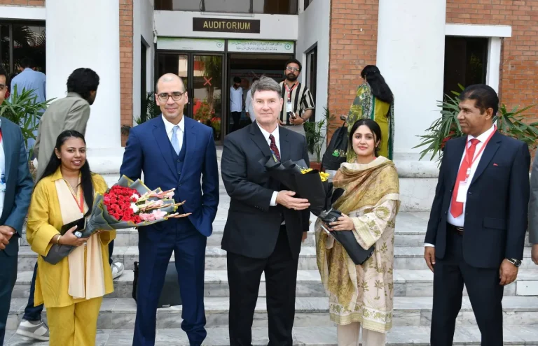 Guests welcomed with bouquets at the auditorium entrance on the opening day of ICELS-26