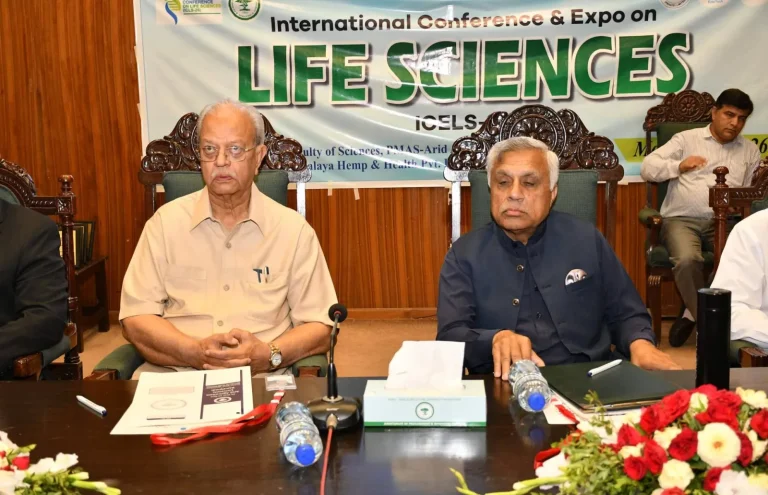 Session chairpersons seated under the Life Sciences ICELS-26 banner in Rawalpindi