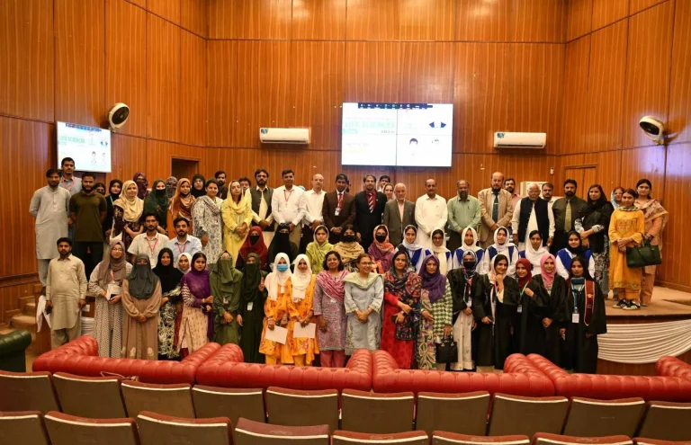 Participants, faculty and organisers group photo in the auditorium at the close of ICELS-26