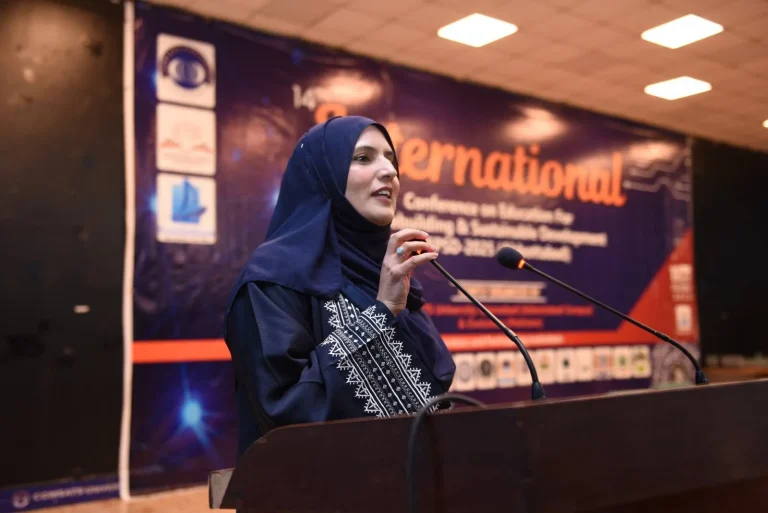 Session chair speaking at the rostrum during ICEPSD-25 in Abbottabad