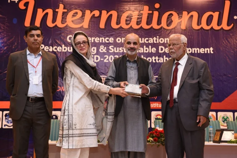 Commemorative shield presented to a guest speaker at the 14th ICEPSD-25 in Abbottabad