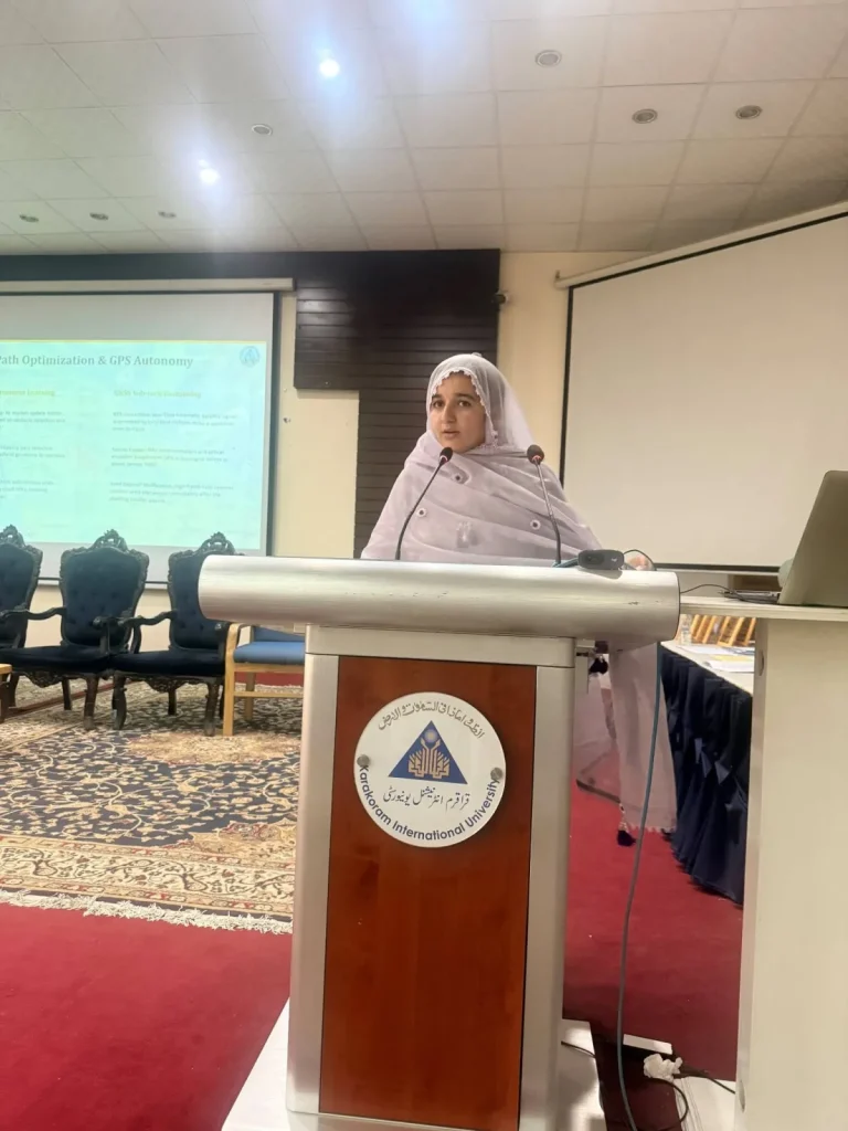 Speaker addressing the delegates from the Karakoram International University rostrum at ICFAS-26
