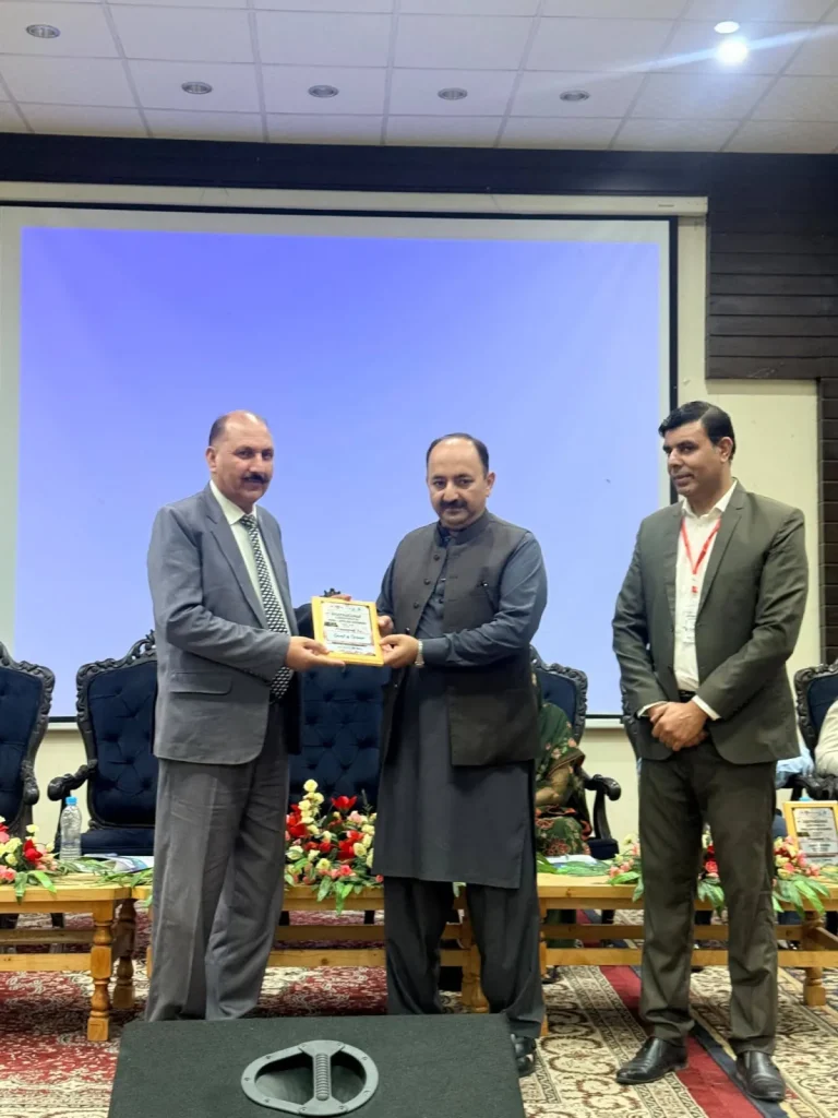 Commemorative shield presented to a guest on the ICFAS-26 stage in Gilgit