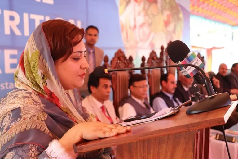 Woman speaker delivering her address at the International Food & Nutrition Conference 2022, Swat
