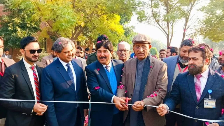 Guests cutting the ribbon to open the Agriculture Expo at IRWACE-25 in Okara