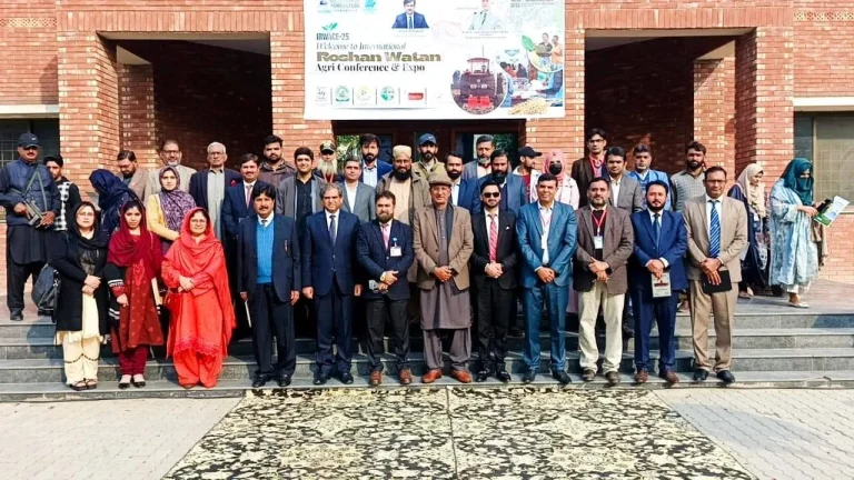 Delegates, faculty and organisers in a group photo under the IRWACE-25 banner at the Depalpur Okara campus