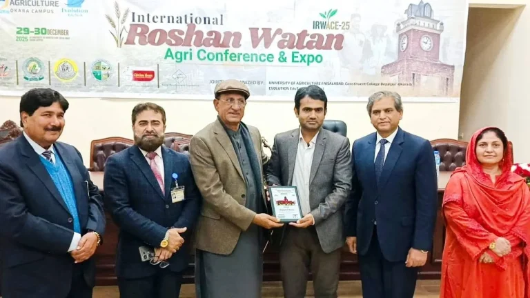 Guest of Honour shield being presented on stage at IRWACE-25 in Okara