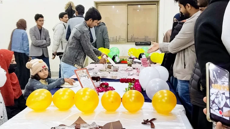 Visitors tasting products at a student stall during the IRWACE-25 Agriculture Expo