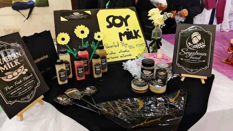 Student stall displaying soyabean milk and soyabean facial products at IRWACE-25 in Okara